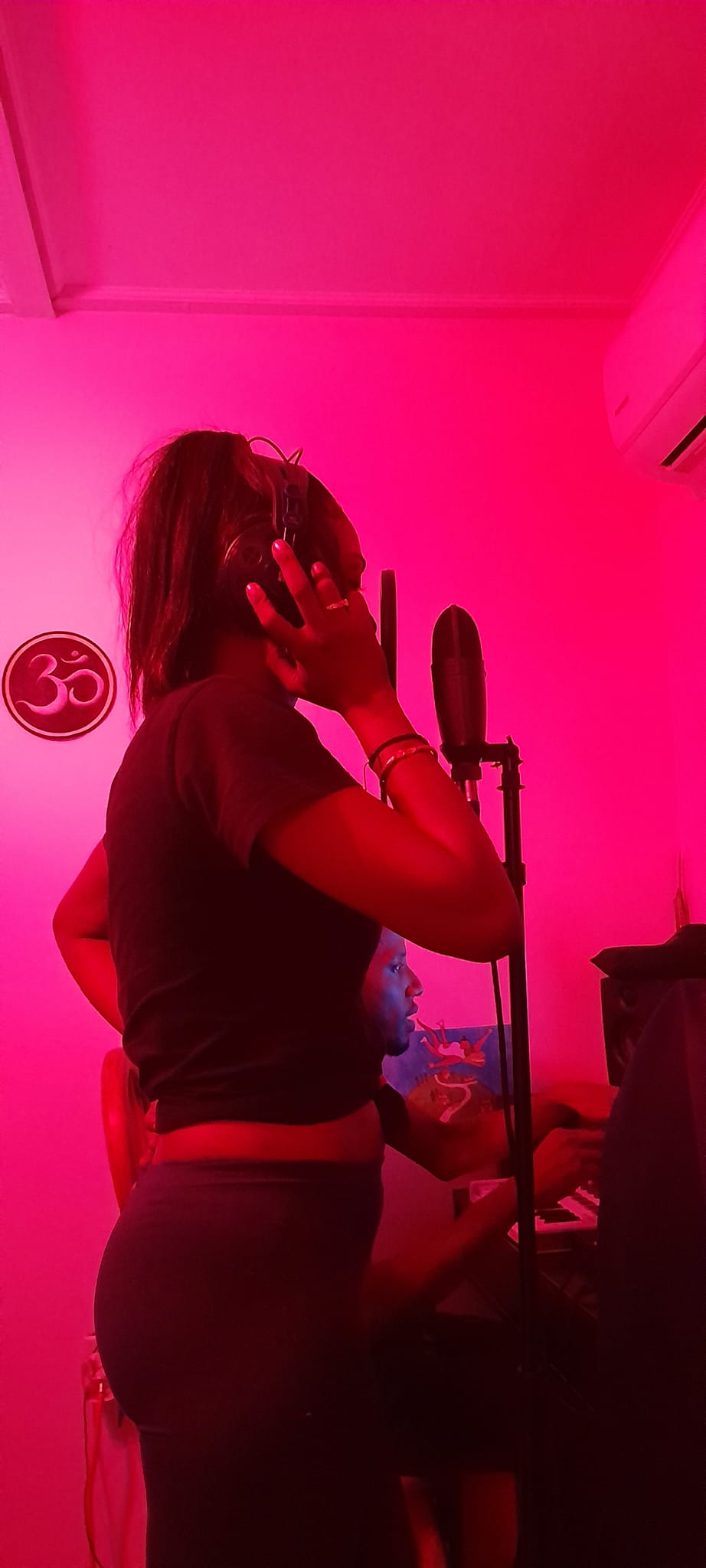 Spirit Kewahres recording in the studio, working on her dance-electronic music